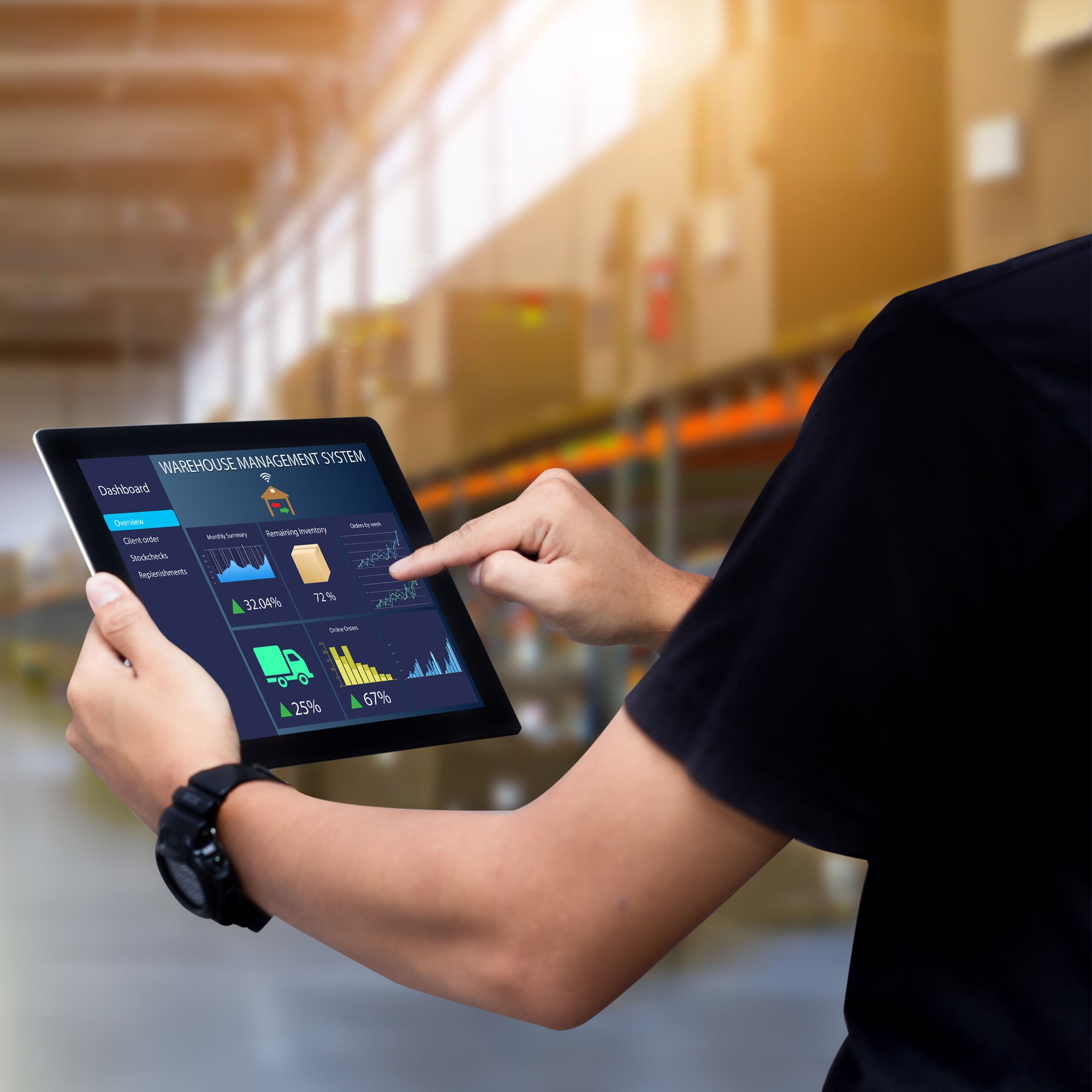 Finance team member reviewing supplier contract compliance data on a tablet.