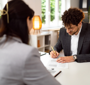Finance leader signs supplier contract after negotiation.