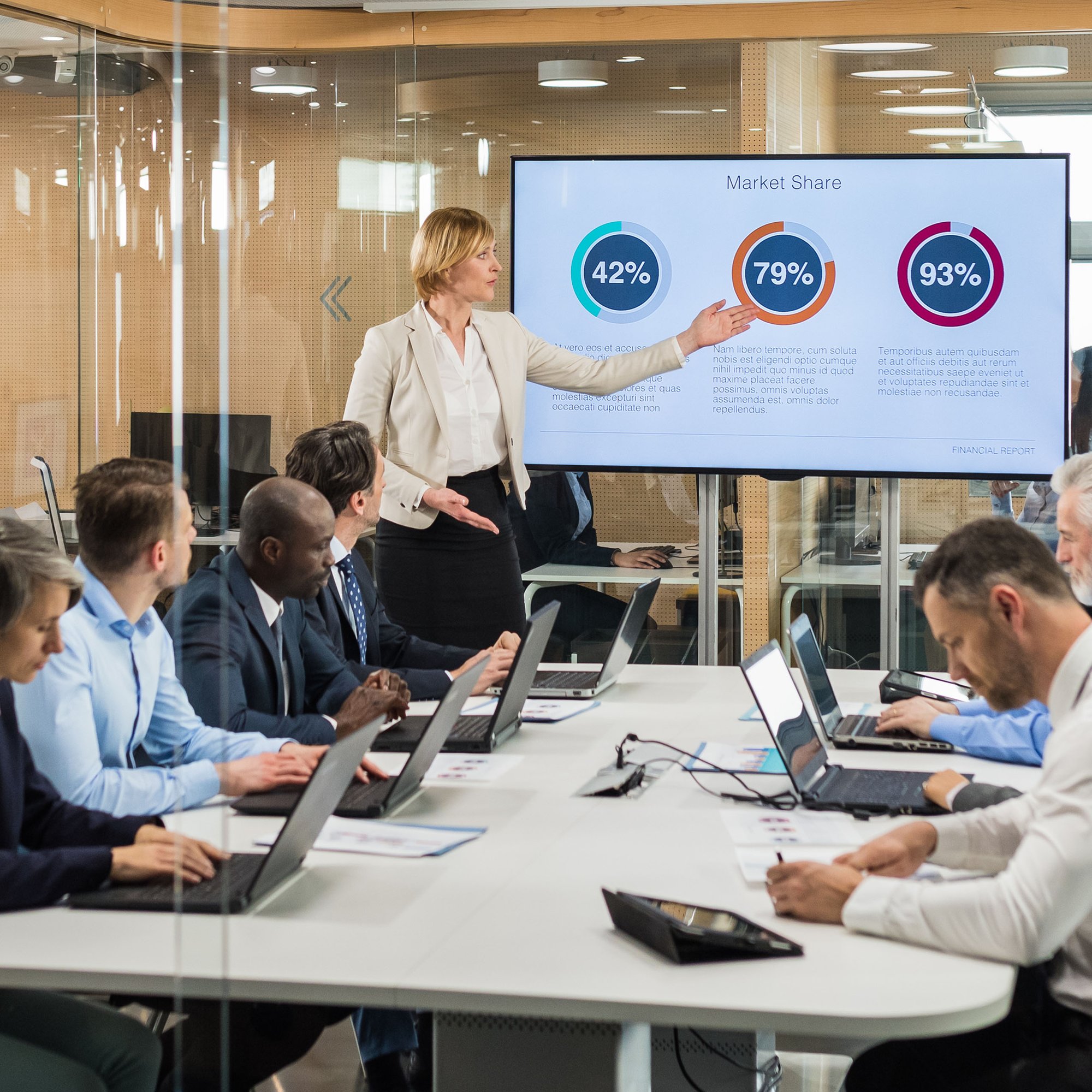 Business team reviewing retail recovery audit analytics presentation in a conference room.