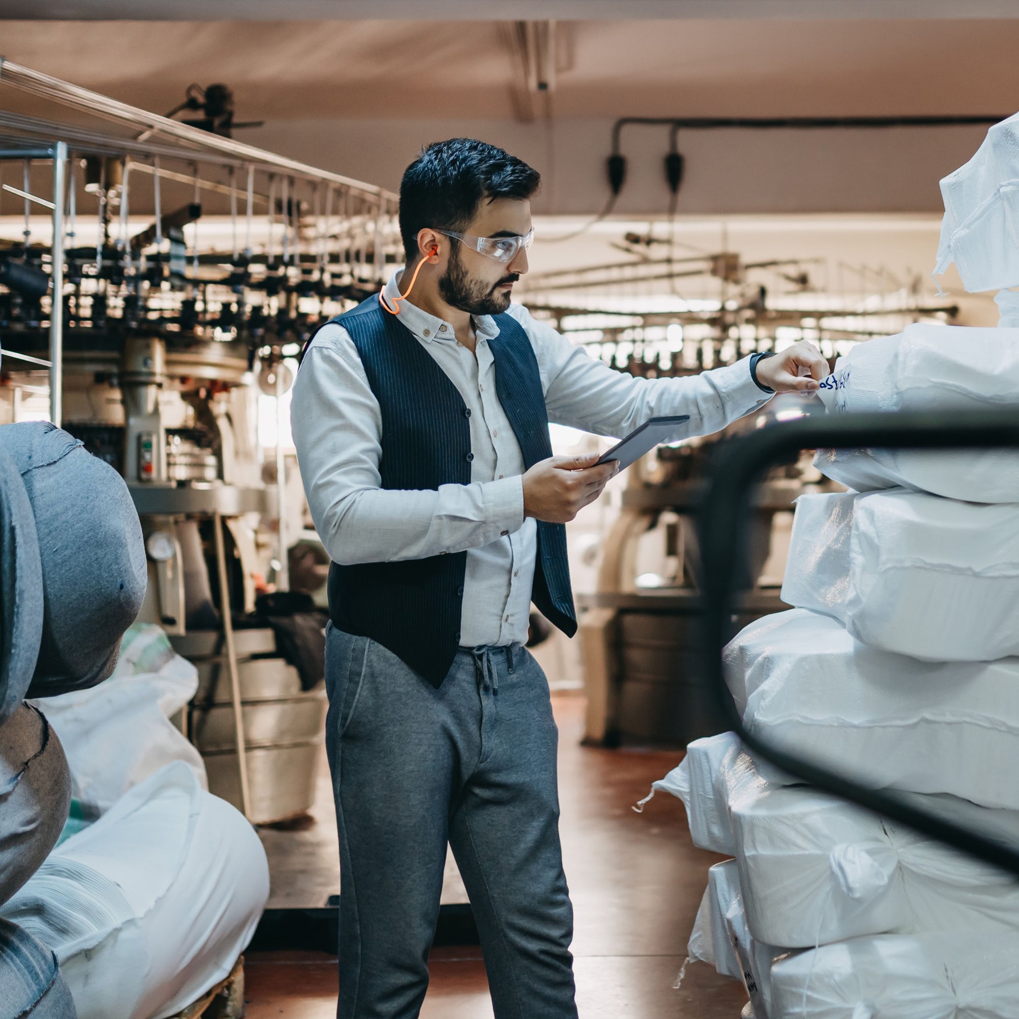 Male retail auditor conducting inventory review.