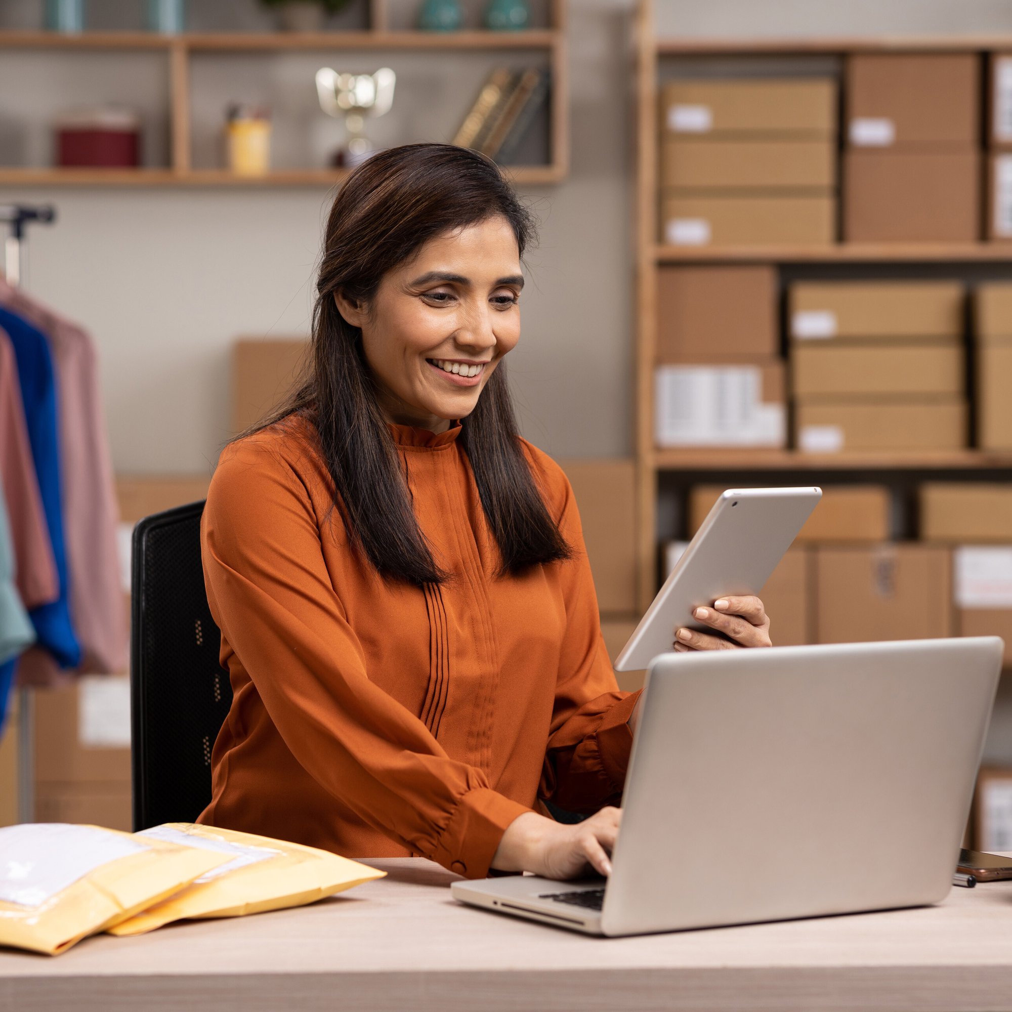 Female AP employee reviews retail store recovery data on her desktop.